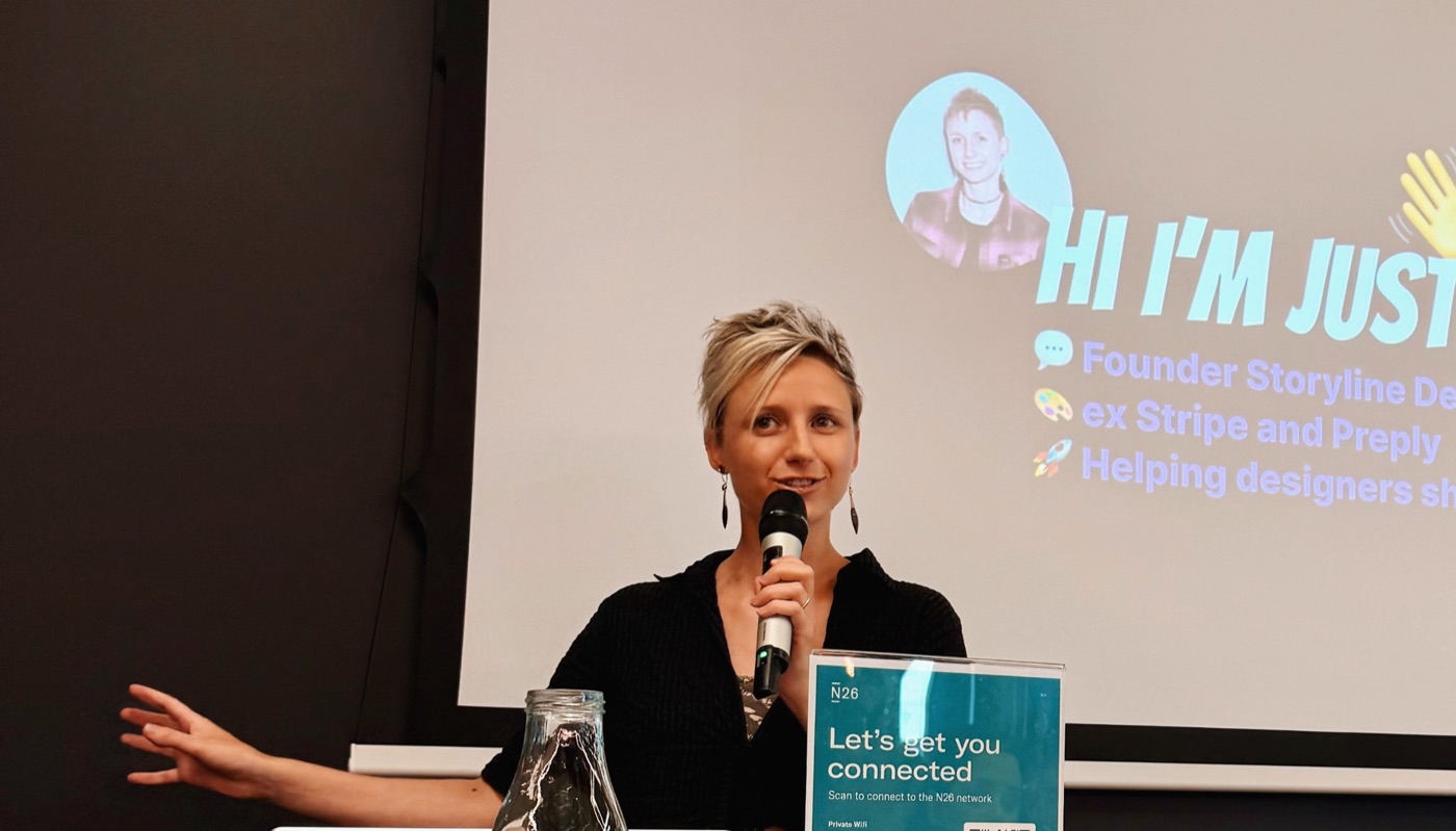 Justine speaking on stage